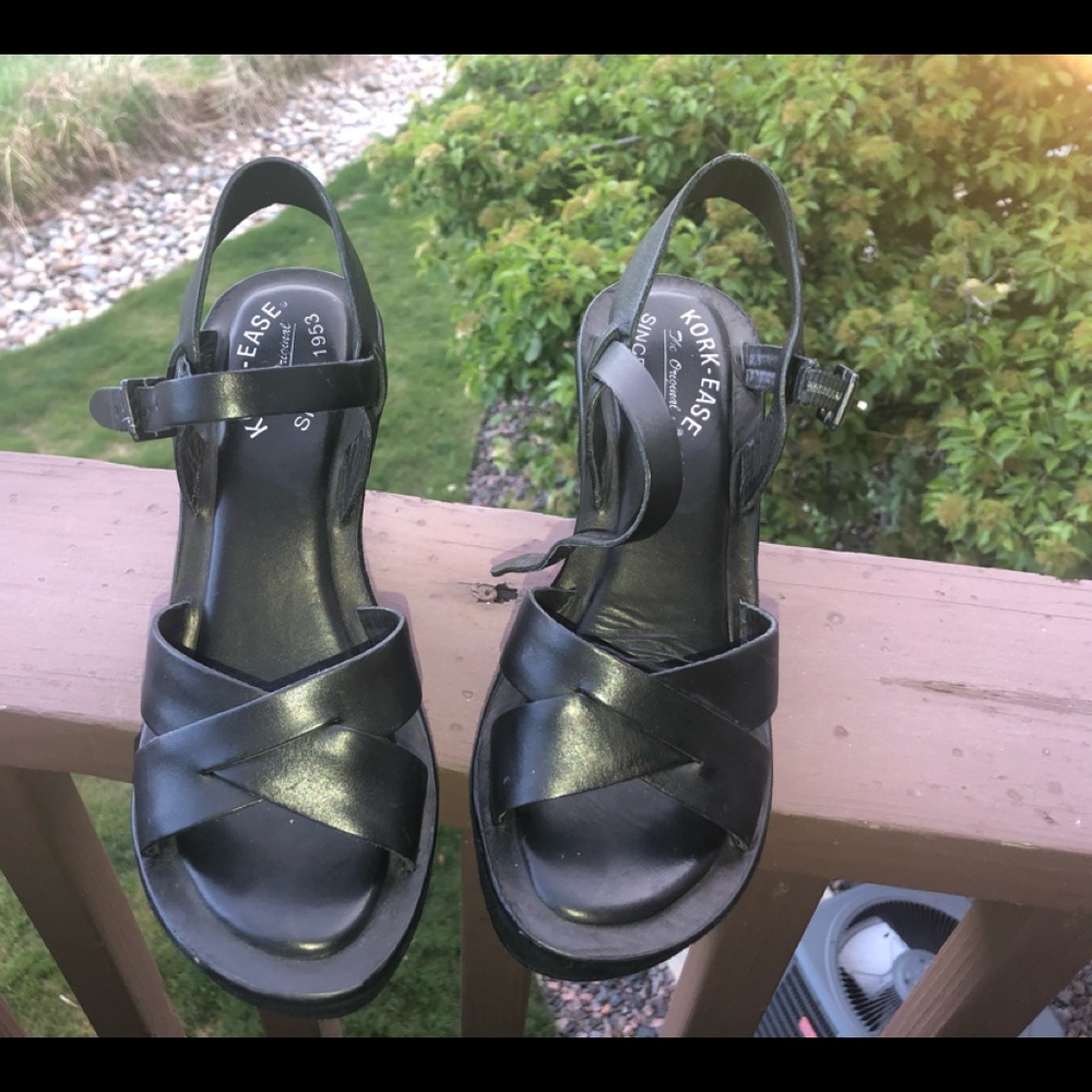 Kork-eas black wedge sandals .